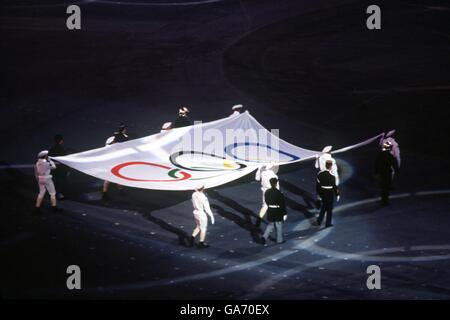 The Olympic flag is carried in during the opening ceremony in Albertville Stock Photo