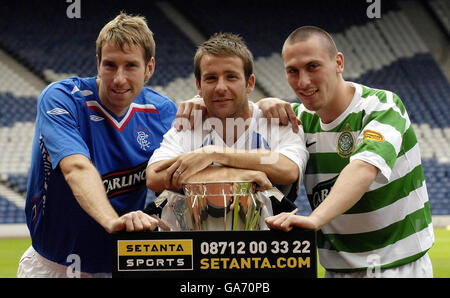 Rangers' Kirk Broadfoot (left), Celtic's Scott Brown (centre) and Kilmarnock captain Gary Hay team up on the pitch at the launch of the new Clydesdale Bank Premier League season at Hampden Park, Glasgow. Stock Photo