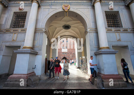 Summer crowds pass through the famous Golden gate of Gdansk at the end of Long lane, a popular tourist place in Poland Stock Photo