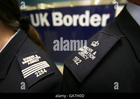 Immigration officers pictured wearing brand new uniforms at Gatwick's border control. Stock Photo