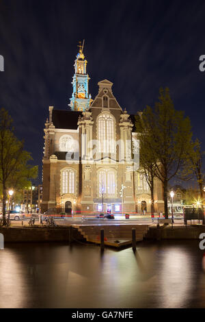 Night shot of the Westerkerk or Western Church in Amsterdam, Netherlands in spring. Stock Photo