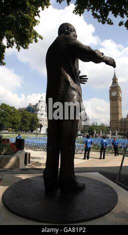 A statue of former South African president Nelson Mandela is unveiled in Parliament Square, opposite the Houses of Parliament in London today. Stock Photo