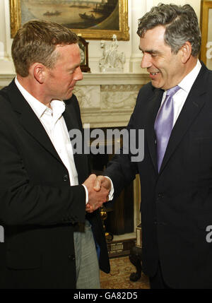 John Smeaton, the Glasgow baggage handler who tackled an alleged terrorist, meets British Prime Minister Gordon Brown at No.10 Downing Street. Stock Photo