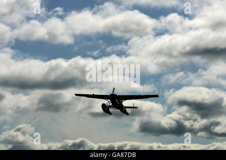 Europe's first city centre seaplane, the Cessna 208, flies over the River Clyde in Glasgow, following the service's official launch. Stock Photo