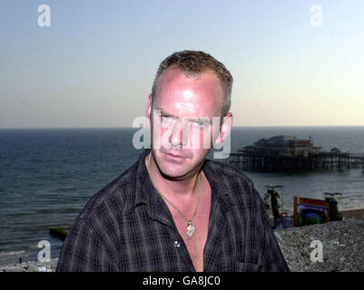 DJ and dance musician Norman Cook AKA Fat Boy Slim on the roof of the Brighton Centre, prior to the free concert on Brighton beach, part of the Channel 4 Summer Tour. Channel 4 have been showing the Ashes cricket match on a large screen on the beach during the day. *...23/07/01Fatboy Slim is flying the flag for Britain, having scooped nine nominations in this year's MTV Video Music awards, it was announced. The star, heads up the shortlist this year, with his video, Weapon of Choice, beating a host of US acts. The ceremony, which celebrates the best music videos of the year has been running Stock Photo