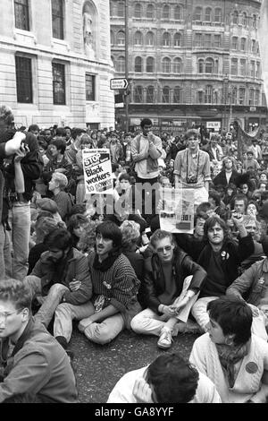Anti-Apartheid protestors staging a sit-down outside the South African Embassy in Trafalgar Square, London. Stock Photo