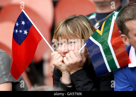 Rugby Union - IRB Rugby World Cup 2007 - Pool A - South Africa v Samoa - Parc des Princes. A rugby fan holds both a South Africa and a Samoa flag in the stands Stock Photo