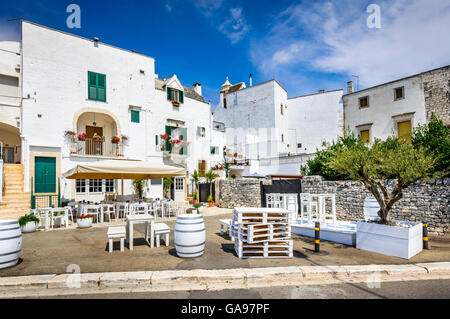 Locorotondo, Italy. Medieval whitewashed street and houses in small city of Puglia, Apulia, Bari region. Stock Photo