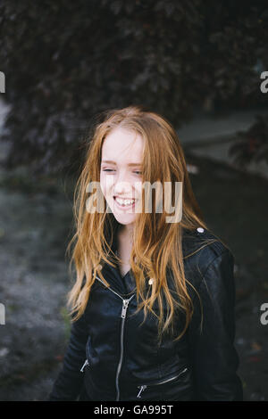 Portrait of a young redhead woman smiling Stock Photo