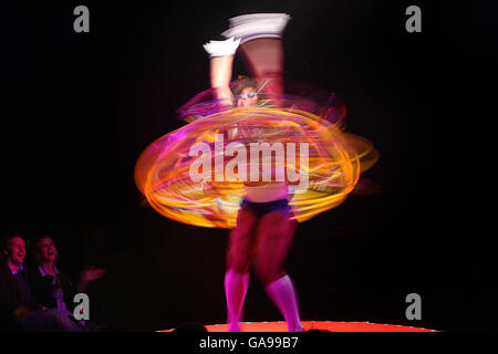 photo. A hula hoop performer at La Clique, the world famous variety show, with cabaret, burlesque and acrobatics, at Dublin's Docklands. Stock Photo