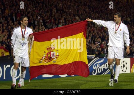 Real Madrid's Raul (l) and Fernando Morientes (r) celebrate with a Spanish flag Stock Photo