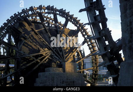 a traditional norias wooden water wheelsl in the city of Hama in Syria in the middle east Stock Photo