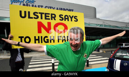 Ryanair's chief executive Michael O'Leary (left), wears a number 11 Northern Ireland International football shirt in memory of George Best, outside George Best Belfast City Airport today where he announced a new four-times a day service to London Stansted out of George Best Belfast City Airport. Stock Photo