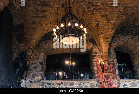 Chandelier hanging in old castle cellar Stock Photo