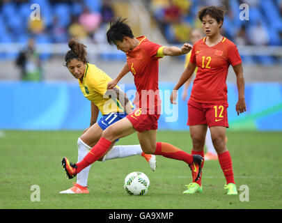 Cristiane of Brazil (l) in action against Donga Li and Shuang Wang (r) of China during the Women's First Round Group E soccer match between Brazil and China at Olympic Stadium prior to the Rio 2016 Olympic Games in Rio de Janeiro, Brazil, 3 August 2016. The Rio 2016 Olympic Games take place from 05 to 21 August. Photo: Soeren Stache/dpa Stock Photo