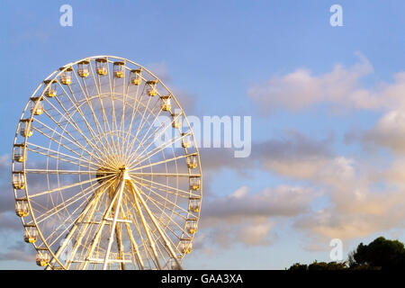 Ferris wheel ride in Southport, Merseyside, UK. 5th August, 2016. UK Weather: Sunrise over Southport Pleasureland, Merseyside. UK. 05-08-2016  The morning sun lights the Big Wheel on Southport's Fairground.  As a new sunny day breaks, the eerie quiet of the stationary rides will be broken by the thousands of tourists who will visit the funfair over the weekend.  Credit:  Cernan Elias/Alamy Live News Stock Photo