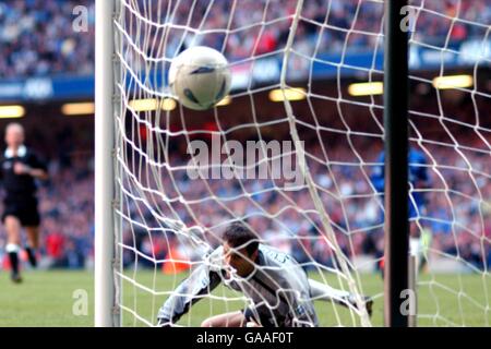 Soccer - AXA FA Cup Final - Arsenal v Chelsea. Chelsea's goalkeeper Carlo Cudicini watches in despair as Fredrik Ljungberg scores Arsenal's second goal Stock Photo