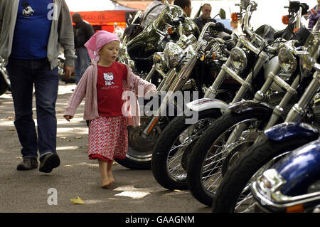 Petra, 5, looks at the bikes as 300 Harley Davidson motorcyclists gather outside London's Great Ormond Street Hospital for Children as part of a fundraiser for the hospital Sunday, September 16, 2007. (Photo Matt Faber/PA PHOTOCALL Stock Photo