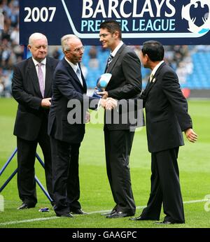 Manchester City owner Thaksin Shinawatra congratulates Manchester City manager Sven Goran Eriksson on picking up his manager of the month award Stock Photo