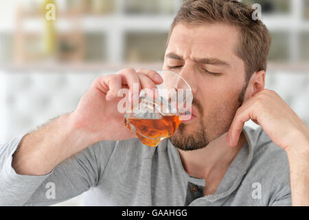 man with whiskey in glass Stock Photo