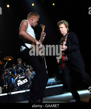 (Left-right) Stewart Copeland (on drums), Sting &amp; Andy Summers of the Police in concert at the National Indoor Arena in Birmingham. Stock Photo