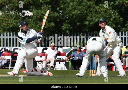 Hampshire captain Shane Warne hits a four during his innings of 46 against Worcestershire during the Liverpool Victoria County Championship Division One match at Chester Road North Ground, Kidderminster. Stock Photo