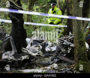 The scene after the helicopter in which Colin McRae was flying crashed ...