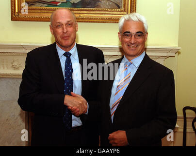 The Chancellor of the Exchequer Alistair Darling (right) shakes hands with Henry Paulson the Secretary of the US Treasury, at a meeting in 11 Downing Street in central London. Stock Photo