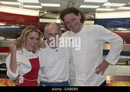 Celebrity chef Marco Pierre-White (right) celebrates with Hell's Kitchen 2007 winner Barry McGuigan (centre) and runner up Adele Silva seconds after McGuigan was announced the overall winner of the reality TV cooking competition at Three Mills Studios in east London. Stock Photo