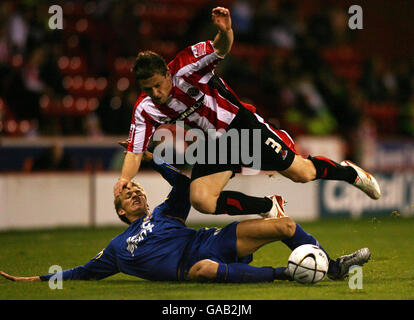 Soccer - Carling Cup - Third Round - Sheffield United v Morecambe - Bramhall Lane. Sheffield United's Gary Naysmith is tackled by Morecambe's Carl Baker during the Carling Cup Third Round match at Bramhall Lane, Sheffield. Stock Photo