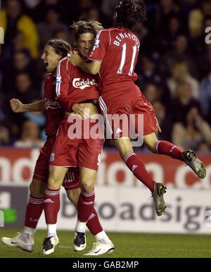 Liverpool's Fernando Torres (centre) celebrates scoring the third goal of the game, with team mates Yossi Benayoun (right) and Leiva Lucas. Stock Photo