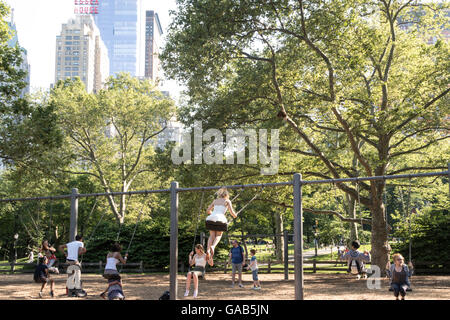 Swings at Heckscher Playground, Central Park, NYC Stock Photo