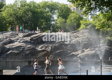 Sprinklers in Heckscher Playground, Central Park, NYC Stock Photo