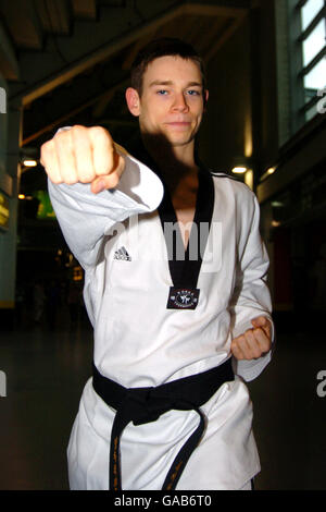 Athletics - 2007 World Taekwondo Bejing Olympic Qualification - MEN Arena. A contestant shows off his Taekwondo skills Stock Photo