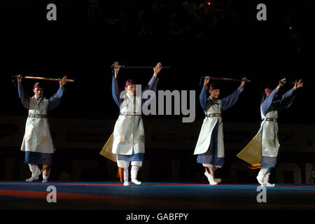 Athletics - 2007 World Taekwondo Bejing Olympic Qualification - MEN Arena. Ahnmia's Korean Dance Trope perform during the 2007 World Taekwondo Bejing Olympic Qualification at the MEN Arena, Manchester. Stock Photo