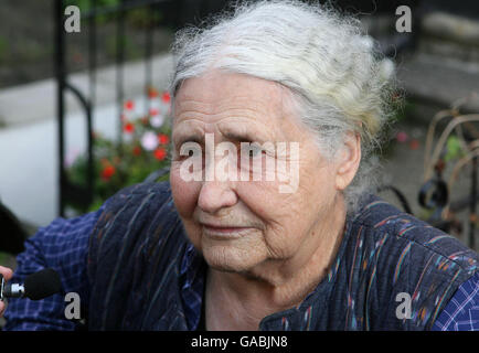 Doris Lessing, author of dozens of works from short stories to science fiction, including the classic 'The Golden Notebook,' speaks to the press outside her home in West Hampstead, north-west London, after it was announced that she had won the Nobel Prize for literature. She was praised by the judges for her 'skepticism, fire and visionary power.' Lessing, 11 days short of her 88th birthday, is the oldest choice ever for a prize that usually goes to authors in their 50s and 60s. Stock Photo