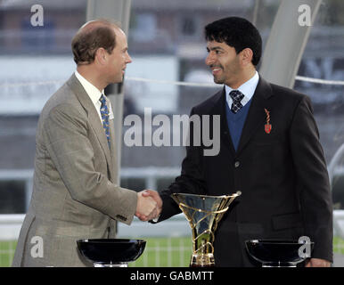 HRH The Earl of Wessex presents the winning trainer trophy to Godolphin's Saeed bin Suroor after Ramonti wins The Queen Elizabeth II Stakes during The Mile Championships day at Ascot Racecourse. Stock Photo