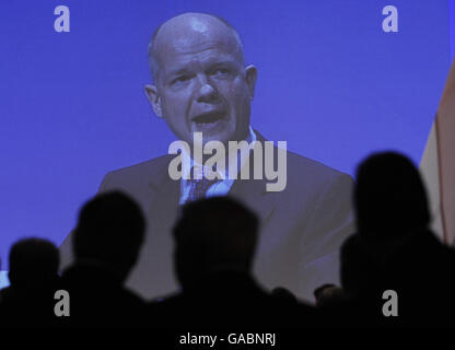 Conservative Shadow Foreign Secretary William Hague is watch on screen by members of the party, at the Conservative Conference held at the winter Gardens in Blackpool.