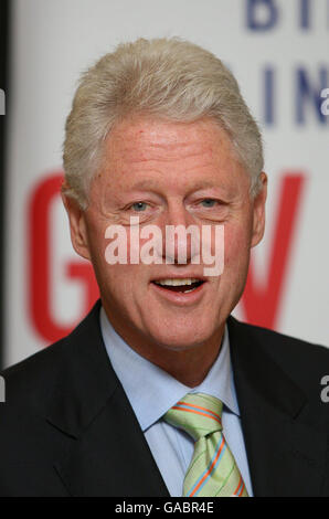 former US President Bill Clinton signs copies of his new book, 'Giving', at Waterstones in central London. Stock Photo