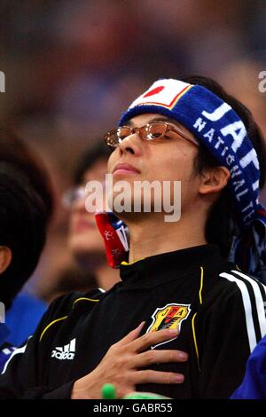 Soccer - FIFA World Cup 2002 - Group A - France v Senegal. A Japanese fan watches the opening ceremony Stock Photo