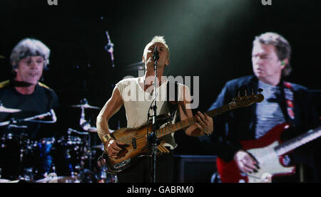 Andy Summers, Sting and Stewart Copeland of The Police perform in concert at Croke Park Stadium in Dublin. Stock Photo