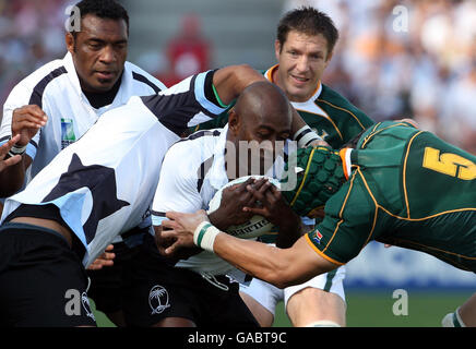 Fiji's Mosese Raulini comes under pressure from South Africa's Victor Matfield during the IRB Rugby World Cup Quarter Final match at Stade Velodrome, Marseille, France. Stock Photo