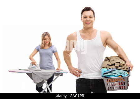 Young couple doing laundry and ironing clothes isolated on white background Stock Photo