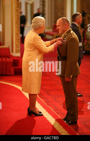 Captain Leigh Woodhouse receives an MBE from The Queen at Buckingham ...