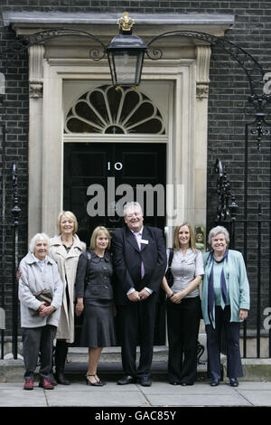 Health campaigners delivering a petition to Downing Street today protesting against proposed guidance on the treatment of osteoporosis. Left to right: Dorothy Borbas, actor Trudie Goodwin, CEO of the National Osteoporosis Society Claire Severgnini, Bob Rees, Merryn Payne and Jo Lye. Stock Photo