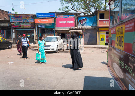 Street scene in Mumbai Maharashtra India Muslim and Hindu women coexiting Stock Photo