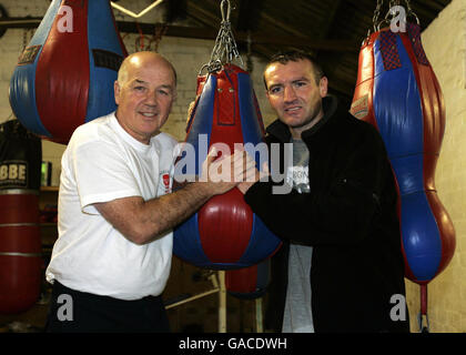 Scotland's Scott Harrison (right) with his father and coach Peter Harrison during a photo call at the Phoenix Amateur Boxing Club in Glasgow. Stock Photo