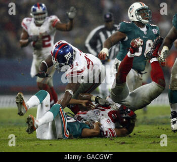 Miami Dolphins quarterback Cleo Lemon fumbles the ball, which was ...