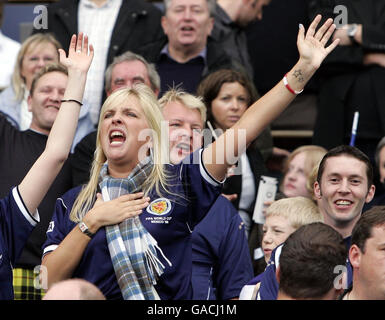 Scotland fans are recorded at half time singing Runrig's anthem Loch Lomond for the charity Children in Need during the UEFA European Championship Qualifying match at Hampden Park, Glasgow. Stock Photo