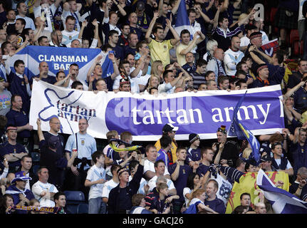 Scotland fans are recorded at half time singing Runrig's anthem Loch Lomond for the charity Children in Need during the UEFA European Championship Qualifying match at Hampden Park, Glasgow. Stock Photo